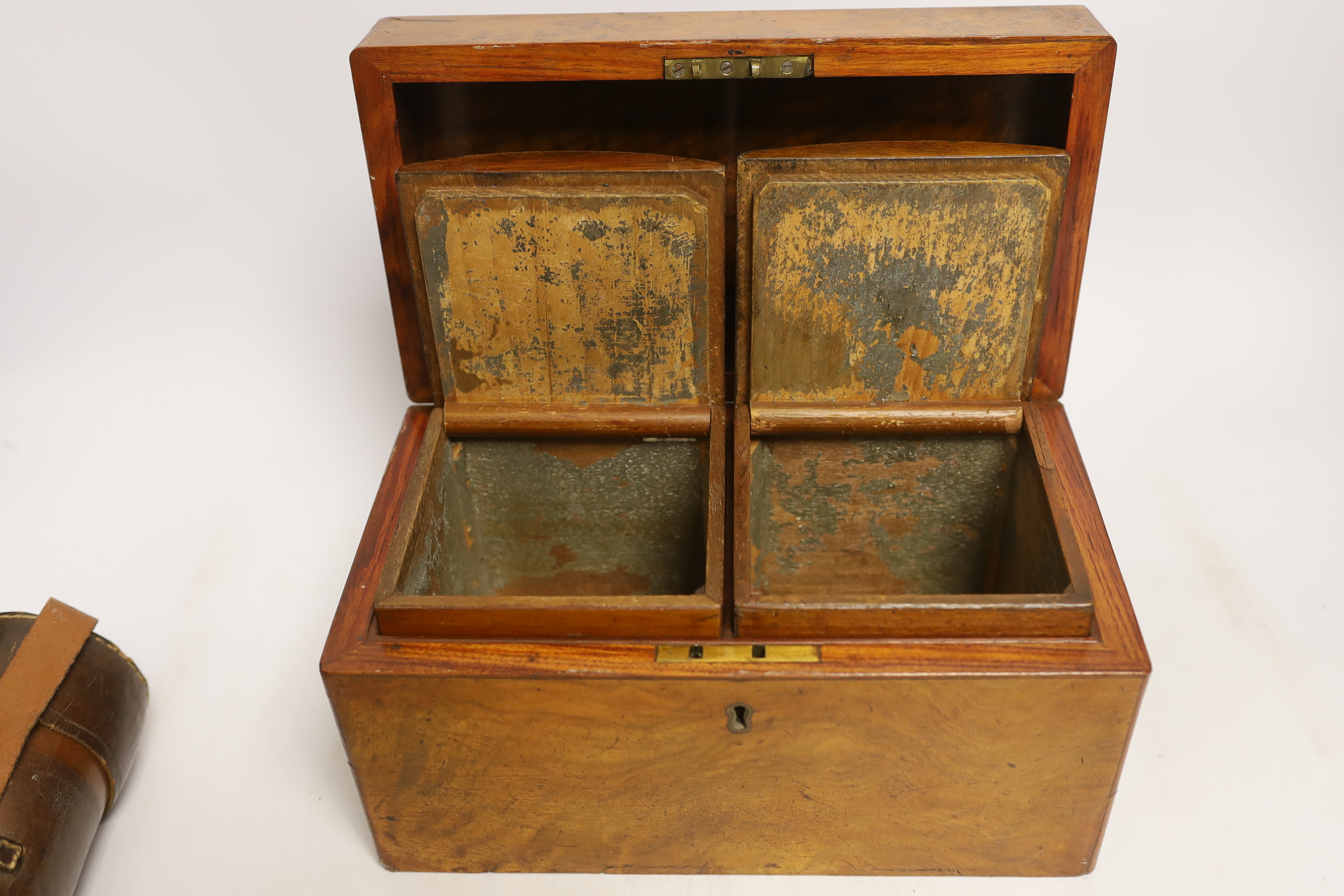 A Victorian walnut tea caddy and 19th century leather cased three draw telescope, signed Silberrad